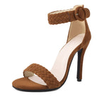 Brown high-heeled sandal with braided design on a white background