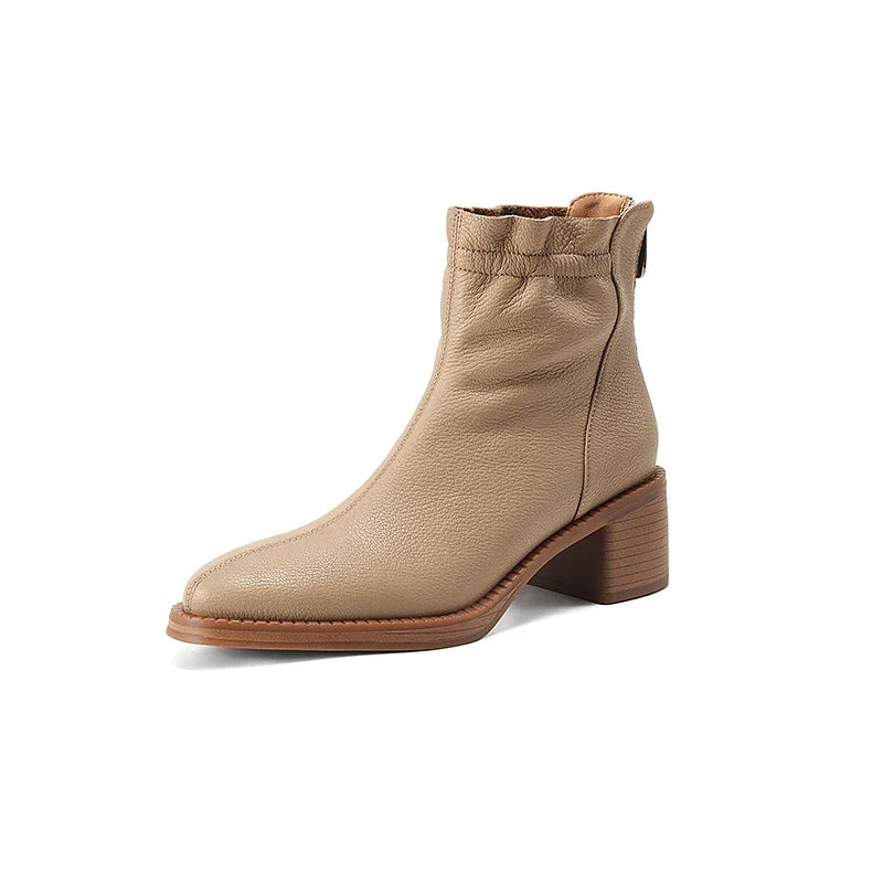 Beige ankle boot on a white background