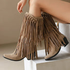Tan fringe boots on a neutral background