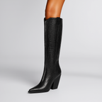 Black knee-high boot on a gray background